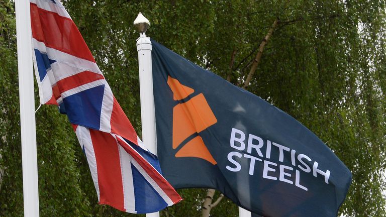 British Steel logo displayed on flags at the entrance to the steelworks plant in Scunthorpe