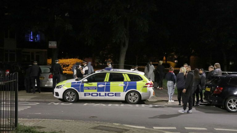 Officers near to the scene of the stabbing in Deeside Road in Wandsworth