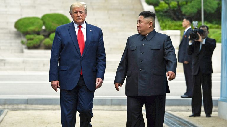 North Korea's leader Kim Jong Un walks southward with US President Donald Trump, after Trump briefly stepped into the north of the Military Demarcation Line that divides North and South Korea, in the Joint Security Area (JSA) of Panmunjom in the Demilitarized zone (DMZ) on June 30, 2019. (Photo by Brendan Smialowski / AFP)        (Photo credit should read BRENDAN SMIALOWSKI/AFP/Getty Images)