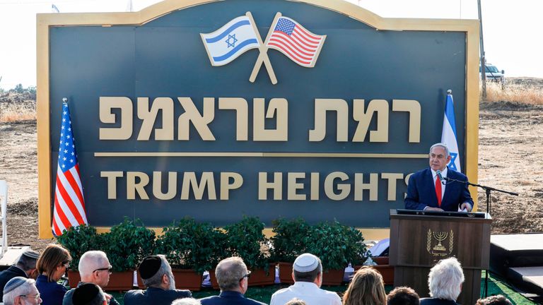Israeli Prime Minister Benjamin Netanyahu gives a speech before the newly-unveiled sign for the new settlement of "Ramat Trump", or "Trump Heights" in English, named after the incumbent US President during an official ceremony in the Israeli-annexed Golan Heights on June 16, 2019