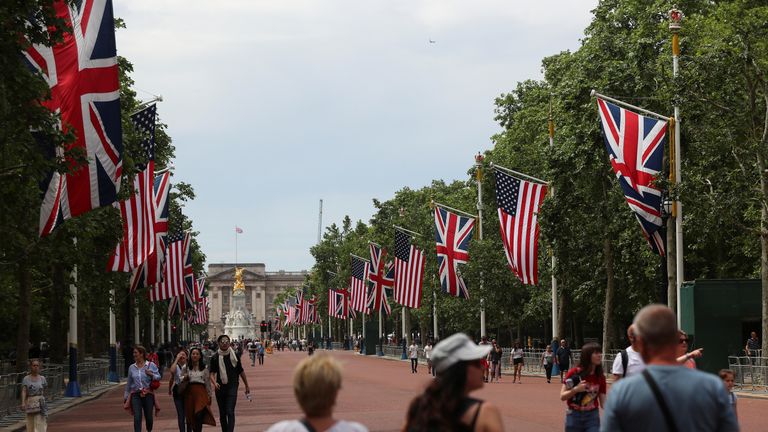 The US flag is lining The Mall leading up to Buckingham Palace