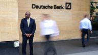 A security guard stands outside the Deutsche Bank building in central London