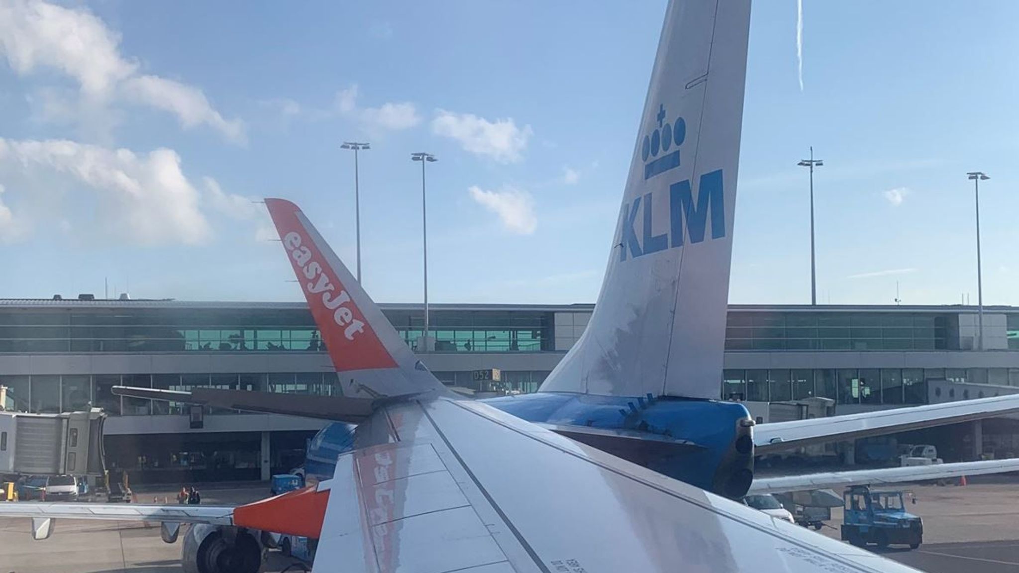 easyJet plane s wing clips KLM jet on ground at Amsterdam airport