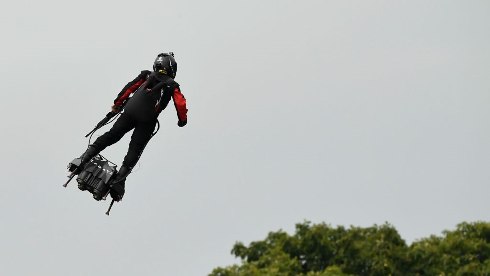 Inventor on flyboard steals the show at Bastille Day celebrations ...
