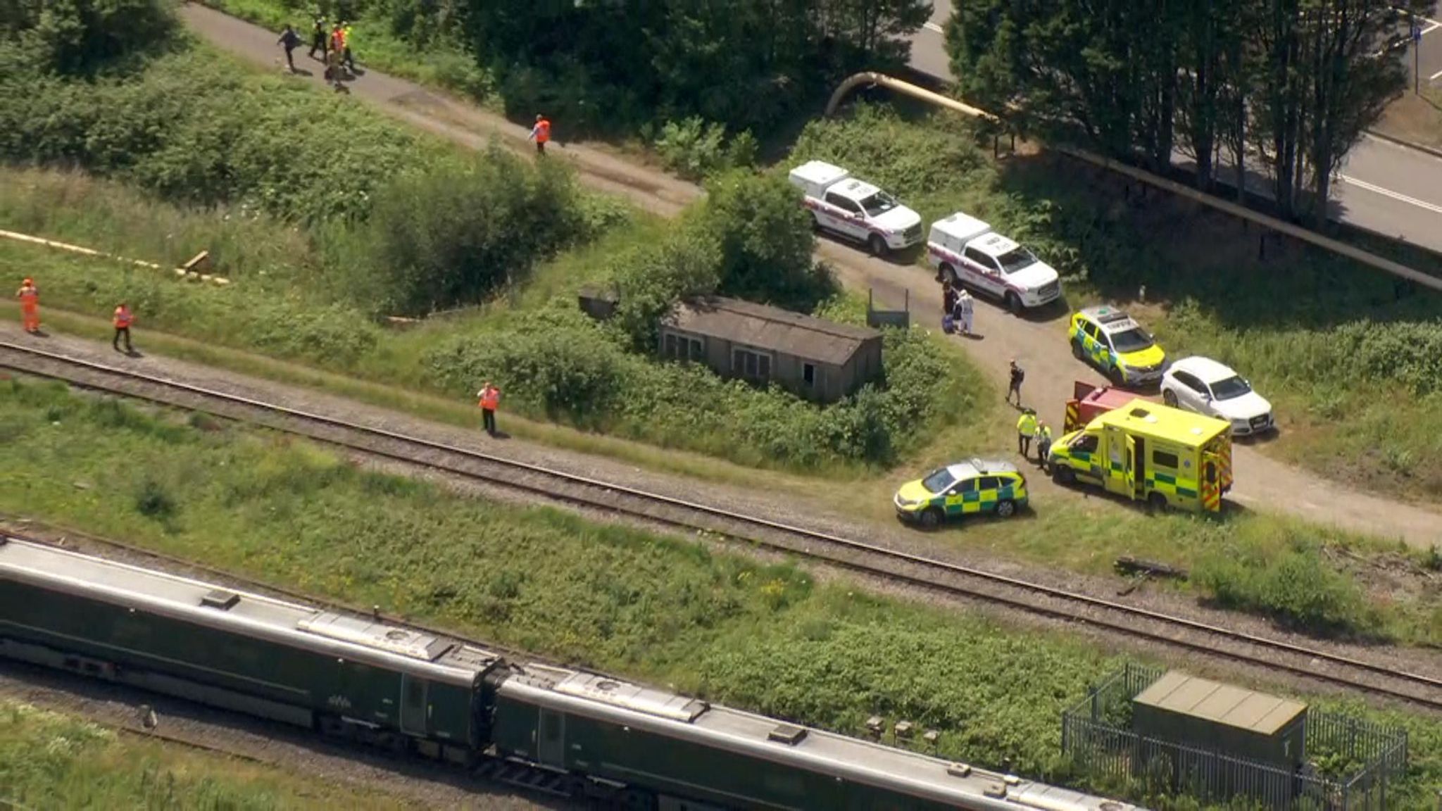 Two railway workers killed after being hit by train 'could not hear it ...