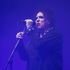 The Cure's Robert Smith puts on 'pop head' for Glasto finale