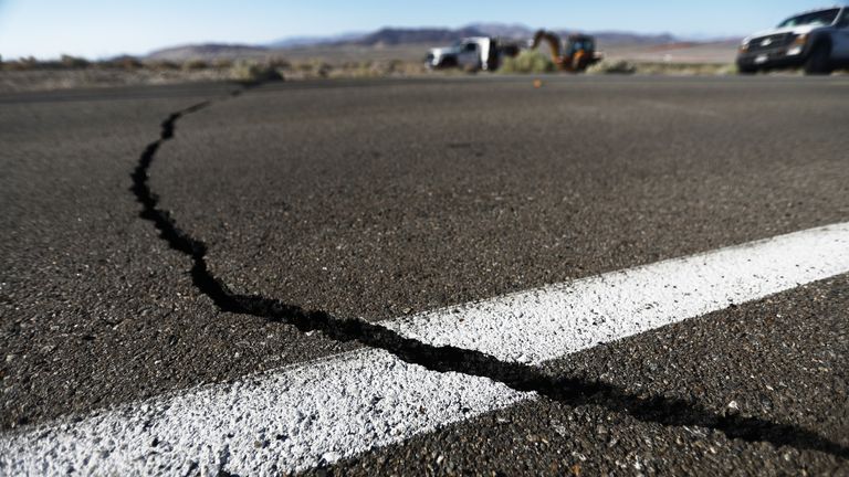 RIDGECREST, CALIFORNIA - JULY 04:  A crack stretches across the road after a 6.4 magnitude earthquake struck the area on July 4, 2019 near Ridgecrest, California. The earthquake was the largest to strike Southern California in 20 years with the epicenter located in a remote area of the Mojave Desert. The temblor was felt by residents across much of Southern California. (Photo by Mario Tama/Getty Images)