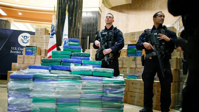 PHILADELPHIA, PA - JUNE 21: Police officers stand guard near cocaine seized from a cargo ship at a Philadelphia port, during a news conference at the U.S. Custom House on June 21, 2019 in Philadelphia, Pennsylvania. At least 17.5 tons of cocaine with more than $1 billion in street value was seized at the Philadelphia seaport, being the largest cocaine seizure in the 230 year history of U.S Customs and Border protection. (Photo by Eduardo Munoz Alvarez/Getty Images)