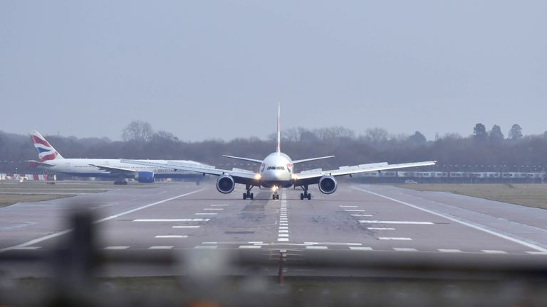 A British Airways plane lands at Gatwick airport which had been closed after drones were spotted over the airfield Wednesday night and throughout Thursday.