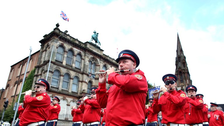 Bandsmen march during the annual Twelfth of July parade in Belfast, on July 12, 2019. - July 12 is the main marching day in the Protestant Orange Order calendar. The parades mark the commemoration of the victory by King William III - the Dutch-born Protestant better known as William of Orange or King Billy - over Catholic King James II at the Battle of the Boyne in 1690. (Photo by Paul Faith / AFP)        (Photo credit should read PAUL FAITH/AFP/Getty Images)