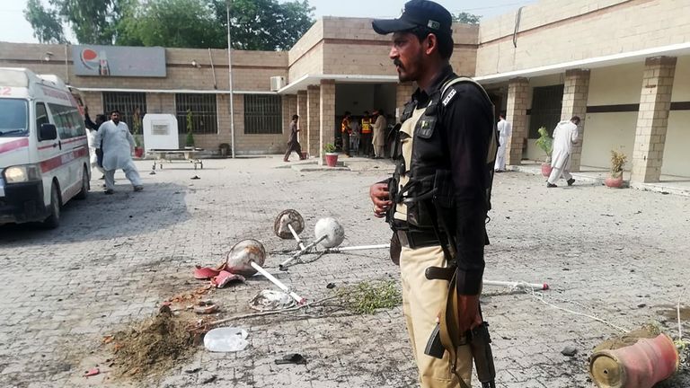 A Pakistani policeman stands guard at site of a suicide bomb attack a hospital entrance in Kotlan Saidan village on the outskirts of the northwestern city of Dera Ismail Khan on July 21, 2019. - A female suicide bomber killed six people -- including two policemen -- in Pakistan's restive northwest on July 21 in an attack claimed by the Taliban, officials said. The attack happened at the entrance of a hospital in Kotlan Saidan village on the outskirts of the northwestern city of Dera Ismail Khan. (Photo by Adil Mughal / AFP)        (Photo credit should read ADIL MUGHAL/AFP/Getty Images)