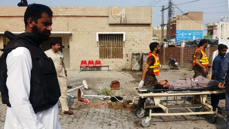 Pakistani rescue personnel move an injured blast victim of a suicide bomb attack at the entrance of a hospital in Kotlan Saidan village on the outskirts of the northwestern city of Dera Ismail Khan on July 21, 2019. - A female suicide bomber killed six people -- including two policemen -- in Pakistan's restive northwest on July 21 in an attack claimed by the Taliban, officials said. The attack happened at the entrance of a hospital in Kotlan Saidan village on the outskirts of the northwestern city of Dera Ismail Khan. (Photo by ADIL MUGHAL / AFP)        (Photo credit should read ADIL MUGHAL/AFP/Getty Images)