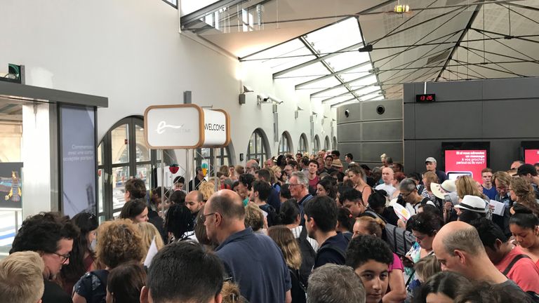 Passengers at Gare de Nord in Paris wait to board the 12.13 Eurostar service to Londons St Pancras International which was delayed due to overhead power line problems in the French capital.