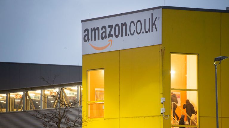 SWANSEA, WALES - NOVEMBER 23: Workers arrive as GMB, the union for Amazon workers, stages a protest over what it claims are &#39;inhuman conditions&#39; at the Amazon Swansea fulfillment centre at Ffordd Amazon on November 23, 2018 in Swansea, Wales. Protests are being held at five Amazon sites across the UK on Black Friday. Amazon recently increased wages for 40,000 permanent and temporary staff to £10.50 an hour in London and £9.50 across the rest of the country. (Photo by Matthew Horwood/Getty Images