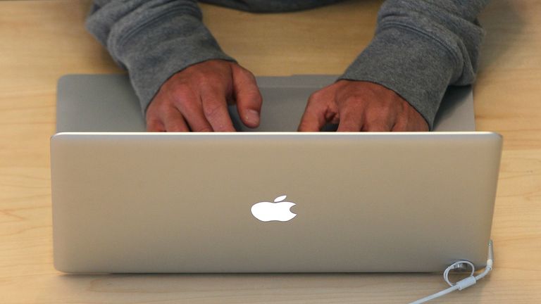 SAN FRANCISCO, CA - MAY 09: A customer types on a MacBook laptop at an Apple Store following an announcement that Apple has become the world&#39;s most valuable brand on May 9, 2011 in San Francisco, California. In a report released by London based Millward Brown, Apple Inc. has surpassed Google to claim the top spot in a global ranking of brand value this year with an estimated value of more than $153 billion up 84 percent from last year. (Photo by Justin Sullivan/Getty Images)
