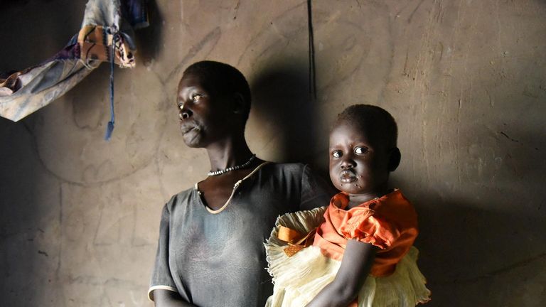 Biec Laat holding her two-month-old son Sebit Pic: UNICEF/UN0261070/Ryen