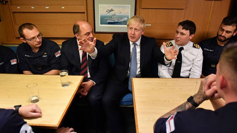 Britain's Prime Minister Boris Johnson (R) aboard Vanguard-class submarine HMS Vengeance