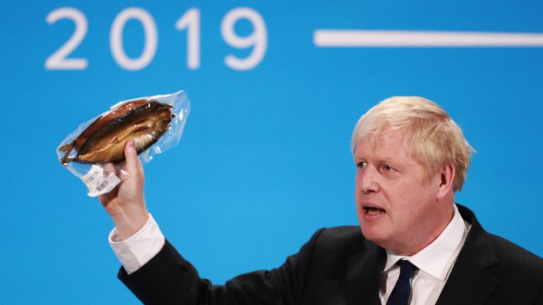 LONDON, ENGLAND - JULY 17: Boris Johnson holds a kipper (smoked fish) to help illustrate a point as he talks at the final hustings of the Conservative leadership campaign at ExCeL London on July 17, 2019 in London, England. Boris Johnson and Jeremy Hunt are the remaining candidates in contention for the Conservative Party Leadership and thus Prime Minister of the UK. Results will be announced on July 23rd 2019. (Photo by Dan Kitwood/Getty Images)