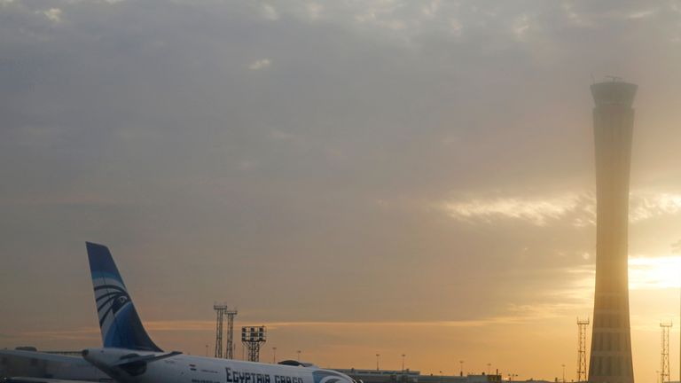 An EgyptAir plane is pictured through the window of an Etihad Airways plane after it landed on the runway at Cairo International Airport, Egypt December 16, 2017. Picture taken December 16, 2017. REUTERS/Amr Abdallah Dalsh