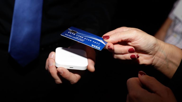 LAS VEGAS, NV - OCTOBER 23: Guests tap to pay using contactless cards to support releif efforts during the Visa ID Intelligence launch party at Money 20/20 on October 23, 2017 in Las Vegas, Nevada. (Photo by Isaac Brekken/Getty Images for VISA Inc)
