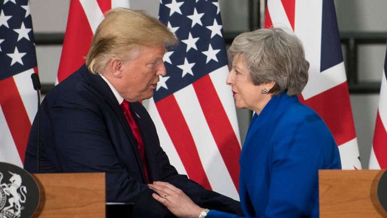 Donald Trump and Theresa May embraced during his UK state visit