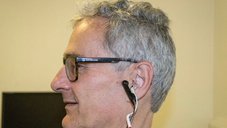 The device is hooked up to a person&#39;s ear to send the electrical current