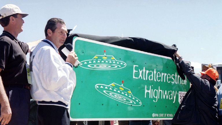 Nevada Governor Bob Miller presides over the unveiling of a new road sign for Nevada State Highway 375 in Rachel, about 150 miles north of Las Vegas. 1996