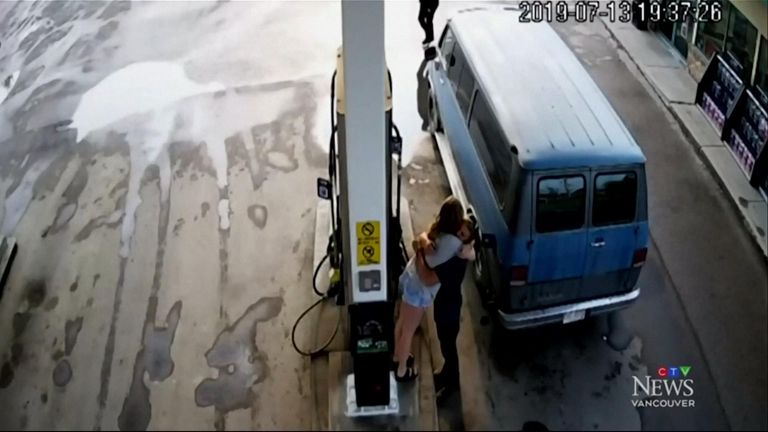 The couple hug before Deese enters the petrol station. Pic: CTV