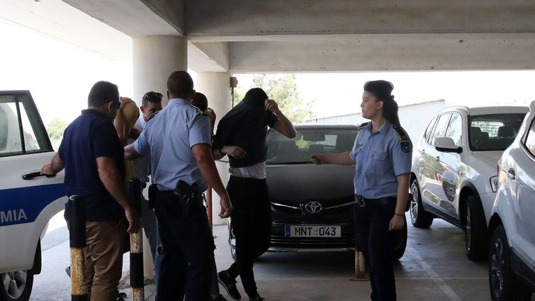Twelve Israeli tourists, suspected of raping a 19-year-old British girl in Ayia Napa, arrive at court