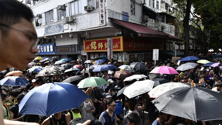 Protesters gathered to march against gangs who beat up pro-democracy demonstrators last weekend