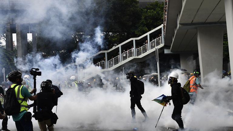 Police fired tear gas at demonstrators as they refused to leave the outlawed rally