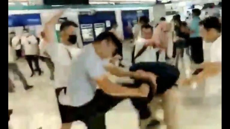 Footage has emerged of masked men in white t-shirts launching a series of violent attacks on activists who attended the pro-democracy demonstrators in Hong Kong.