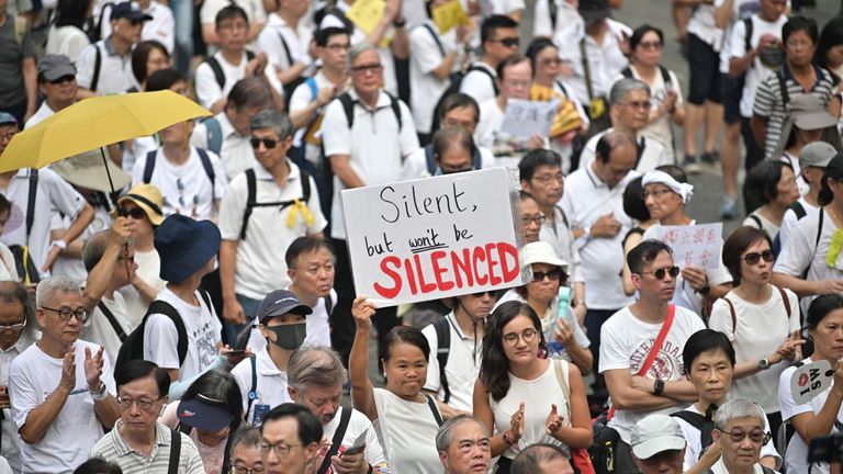 The marchers condemned police for their handling of a protest on Sunday in which an officer had a finger bitten off