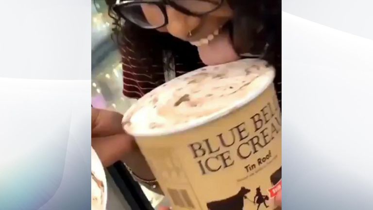A woman filmed licking a tub of ice cream and returning it to a supermarket shelf in a viral video is facing up to 20 years in prison.