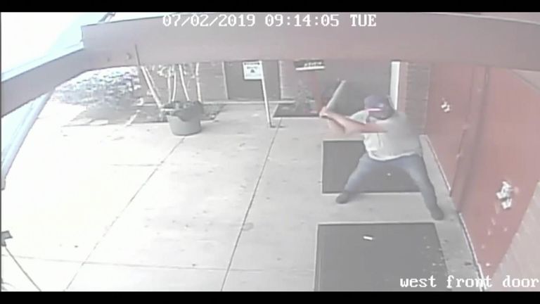 A man was arrested after a security camera captured him allegedly using a metal pipe to smash his way through the doors of a church in California.