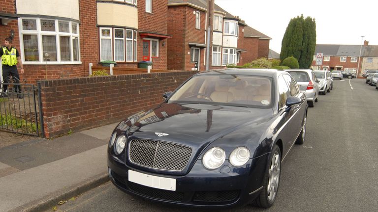 A Bentley parked outside a house linked to the modern slavery ring 