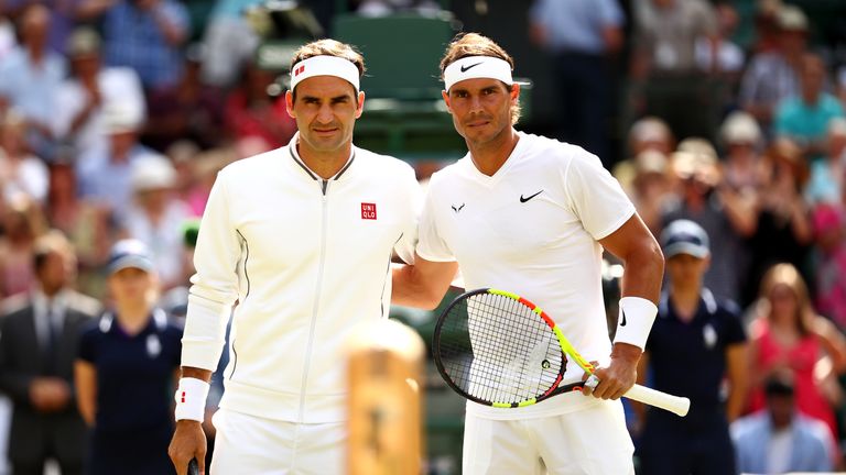 LONDON, ENGLAND - JULY 12: Roger Federer of Switzerland and Rafael Nadal of Spain pose for a picture at the net prior to their Men&#39;s Singles semi-final match during Day eleven of The Championships - Wimbledon 2019 at All England Lawn Tennis and Croquet Club on July 12, 2019 in London, England. (Photo by Clive Brunskill/Getty Images)
