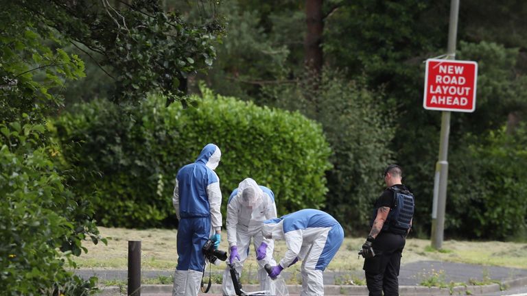 FACES PIXELATED BY PA PICTURE DESK..An ammunition technical officer and forensic officers in Tullygally Road, Craigavon, Co Armagh after an explosive device used by dissident republicans in a failed bid to kill police officers was discovered. PRESS ASSOCIATION Photo. Picture date: Saturday July 27, 2019. See PA story ULSTER Bomb. Photo credit should read: Brian Lawless/PA Wire 