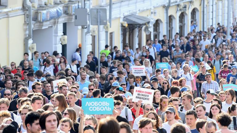 Protesters walk in downtown Moscow during an unauthorised rally demanding independent and opposition candidates be allowed to run for office in local election in September, on July 27, 2019. (Photo by Kirill KUDRYAVTSEV / AFP) (Photo credit should read KIRILL KUDRYAVTSEV/AFP/Getty Images)
