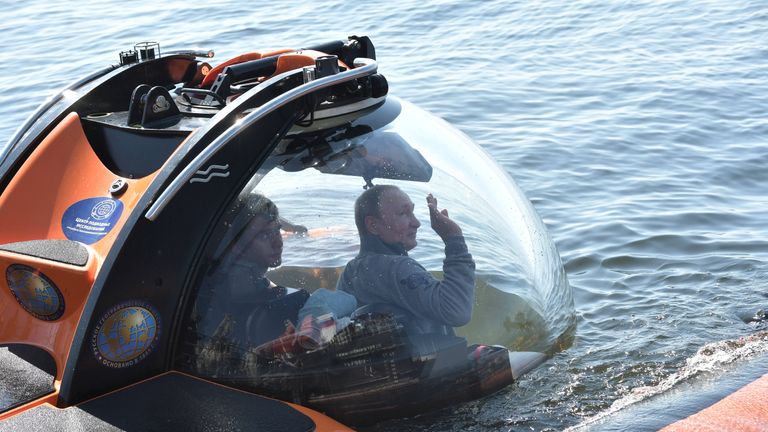 Russian president Vladimir Putin took dive in a submersible to explore Soviet submarine which sank during World War II. 