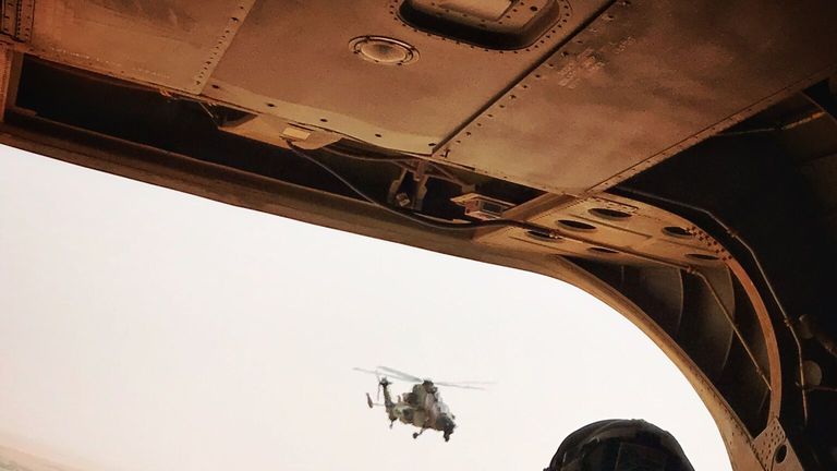 Two RAF Chinooks flying low over Mali delivering troops and equipment to French forces