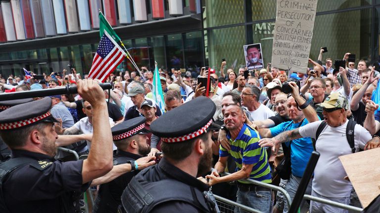 Supporters of Tommy Robinson clash with police outside the Old Bailey in London after the former EDL leader was found in contempt of court by High Court judges for filming defendants in a criminal trial and broadcasting the footage on social media. PRESS ASSOCIATION Photo. Picture date: Friday July 5, 2019. See PA story COURTS Robinson. Photo credit should read: Aaron Chown/PA Wire 