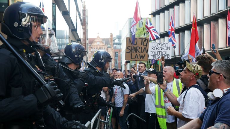 People protest outside the Old Bailey after British far-right activist and former leader and founder of English Defence League (EDL), Tommy Robinson