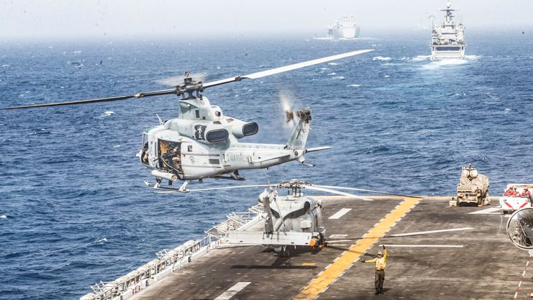 A UH-1Y Venom helicopter with Marine Medium Tiltrotor Squadron (VMM) 163 (Reinforced), 11th Marine Expeditionary Unit (MEU), takes off from the flight deck of the amphibious assault ship USS Boxer (LHD 4) during its transit through Strait of Hormuz in Gulf of Oman, Arabian Sea