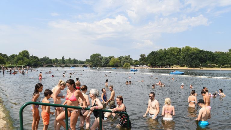 LONDON, ENGLAND - JULY 25: People attempt to cool off from the high temperatures in Hyde Park&#39;s Serpentine lake on July 25, 2019 in London, United Kingdom. The Met Office issued a weather warning from 3pm this afternoon. They warn that Britain could face up to 13 hours of electrical storms after it was forecast that temperatures could reach a record-breaking 39C. (Photo by James D. Morgan/Getty Images)
