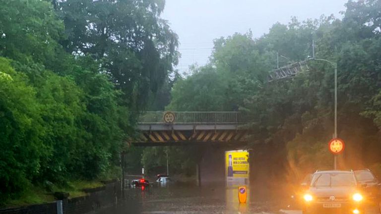 Vehicles stuck in several feet of water at Heaton Chapel in Stockport, Manchester
