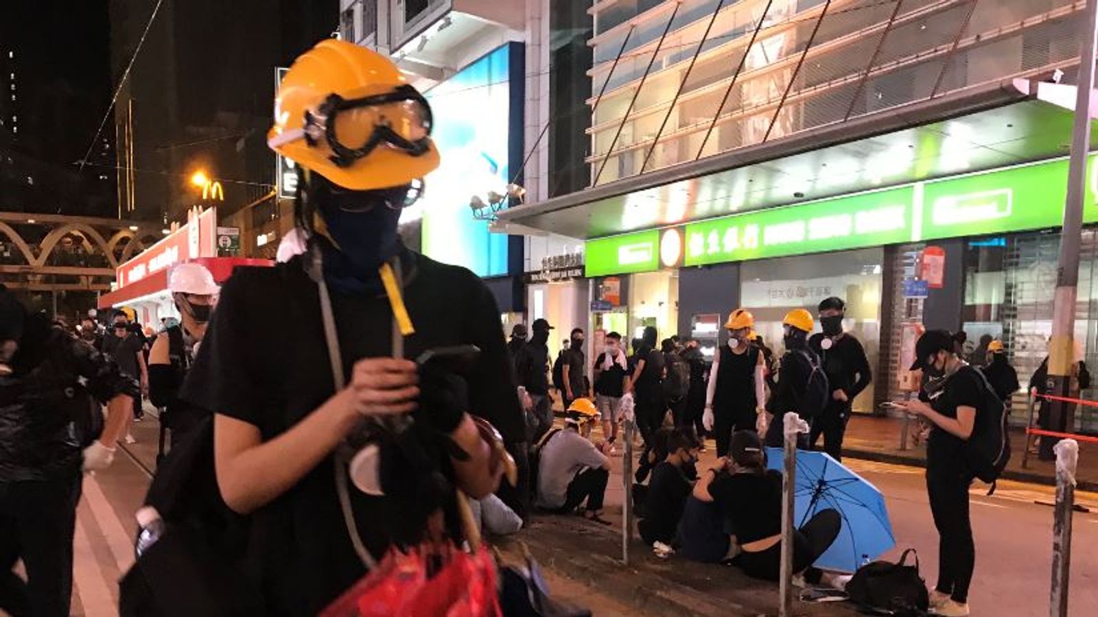 Hong Kong protests: Shoppers and tourists in one street and a riot in ...