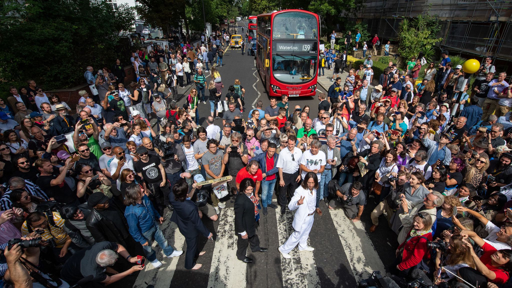 As The Beatles' Abbey Road turns 50, fans recreate iconic album cover photo  in London – Firstpost