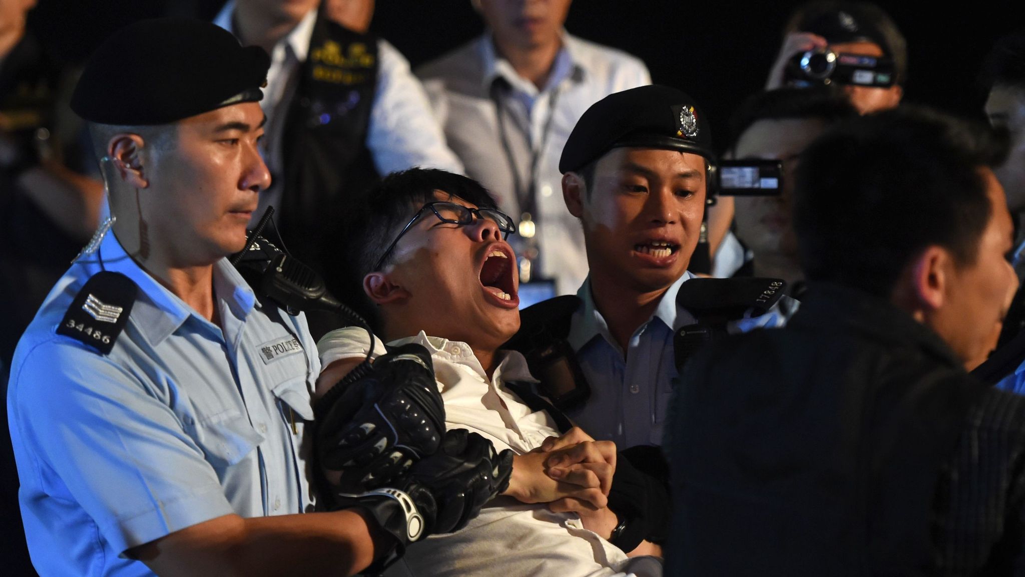 Hong Kong activist Joshua Wong vows to continue protests despite arrest ...