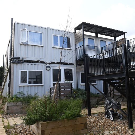 Children 'robbed of childhood' as families housed in converted shipping containers and offices